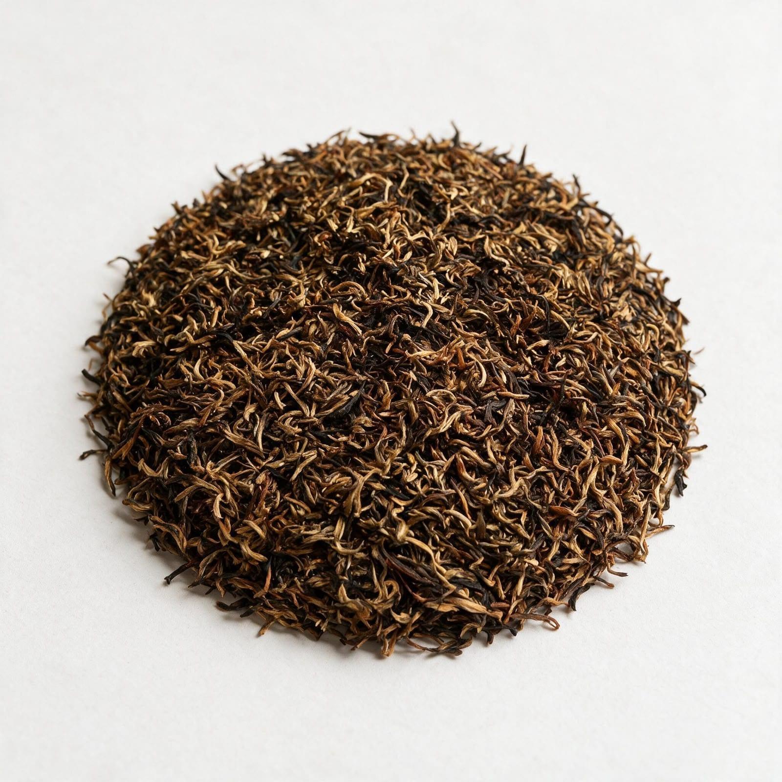 Bokakhat orthodox leaf — long, twisted whole leaf heavy with golden tips